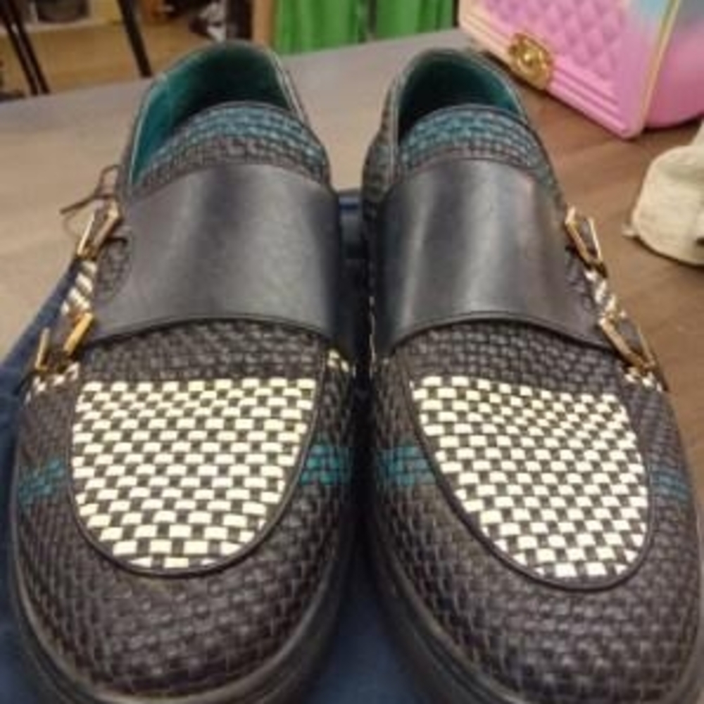 Stylish Black and White Woven Loafers with Gold Buckles